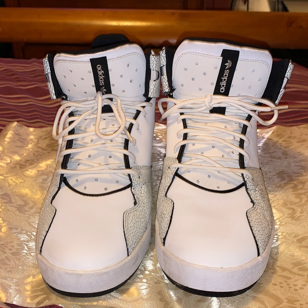 Excellent condition men white and black mid top adidas size 11.5. True to size